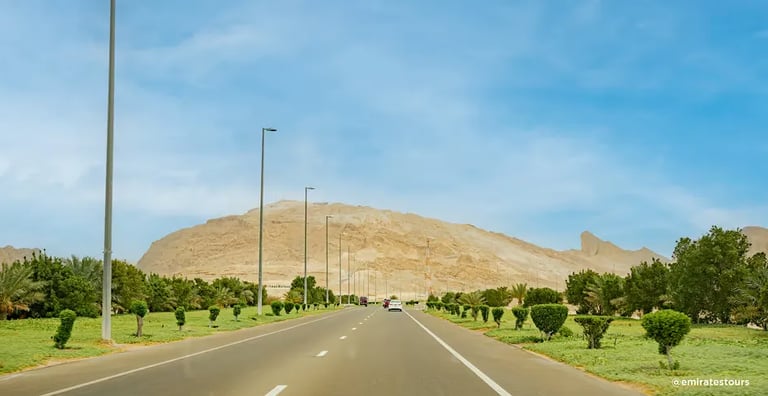 Discover Al Ain's landmarks, oases, Jebel Hafeet views, camel market, and rich traditions