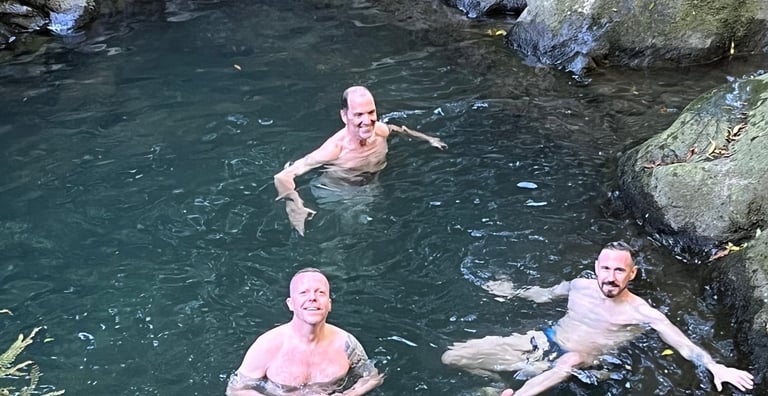 gay men swimming in retreat lagoon