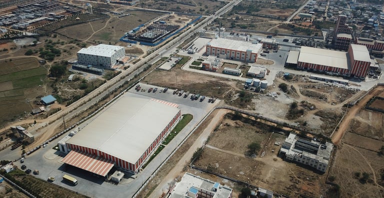 a large building with a large white roof and a large building