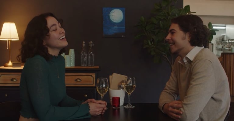 a man and woman sitting at a table