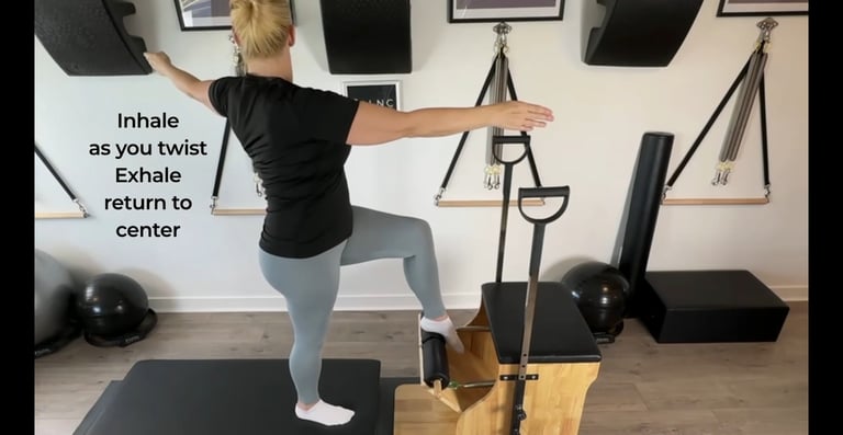 a woman working with the Pilates chair