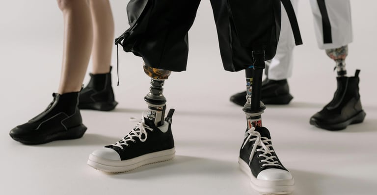 Close up of 3 people's artificial legs