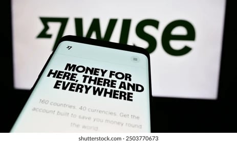 a phone with a sign that says, money is the best way to buy- wise