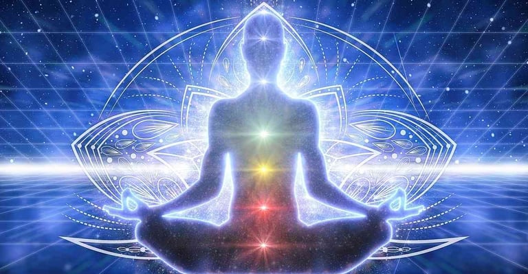 a person sitting in a lotus position with a glowing light shining in the background
