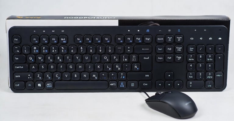 Black wired full-size keyboard and optical mouse set with round keys and number pad.