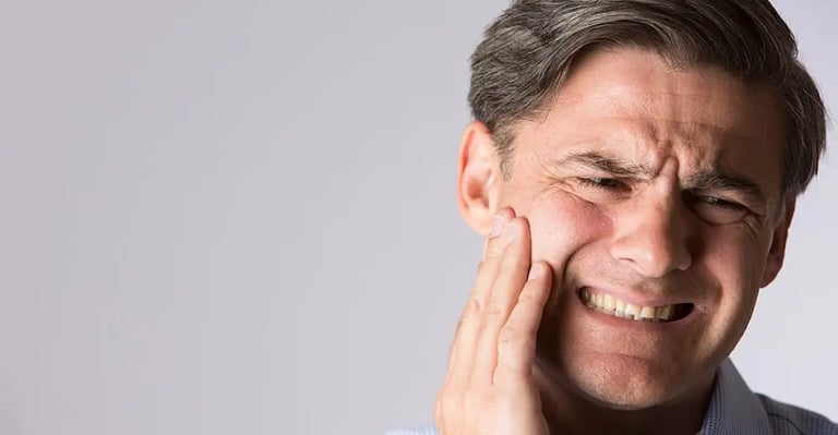 a person keeping hands in jaw due to jaw pain