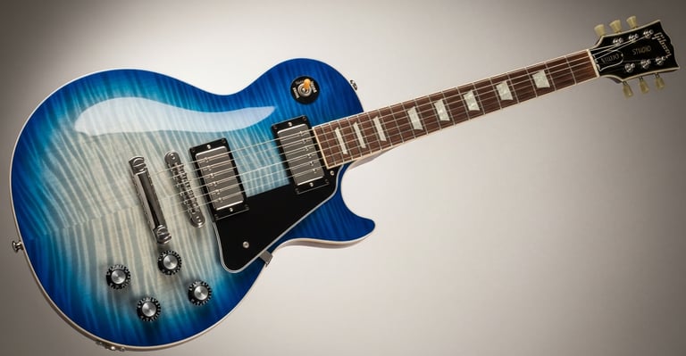 Gibson Les Paul Studio electric guitar in a striking blue burst finish with chrome hardware.
