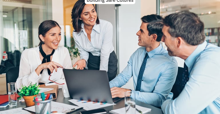 Leaders happily sharing ideas in the boardroom