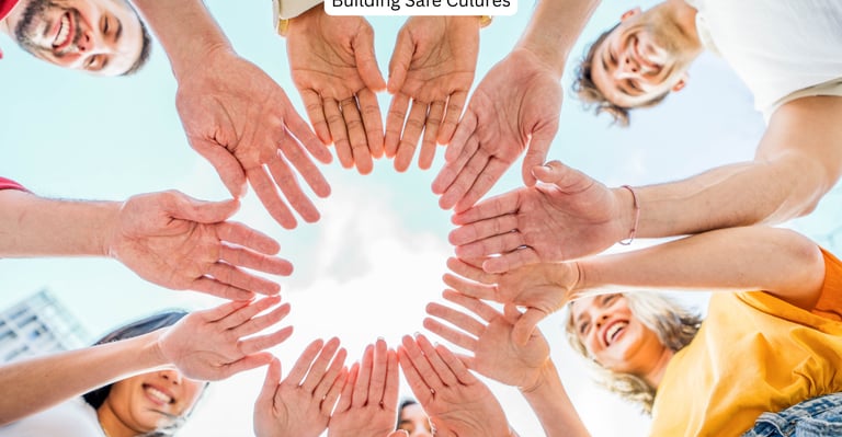 Youth celebrating with all hands together in a circle