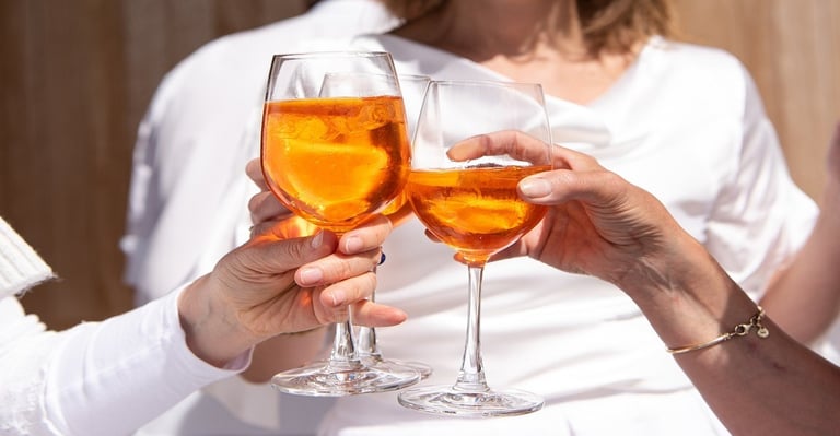 People holding alcohol in glass