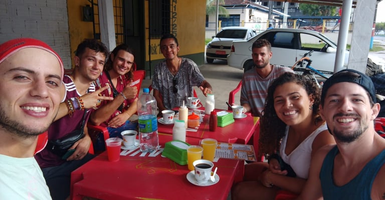 a group of people sitting at a table with drinks