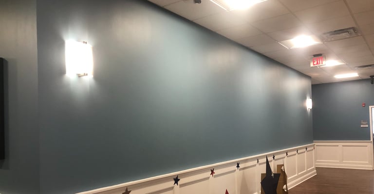 Lobby wall before bespoke mural by Marcine at Mount Bethel Village in Warren, NJ