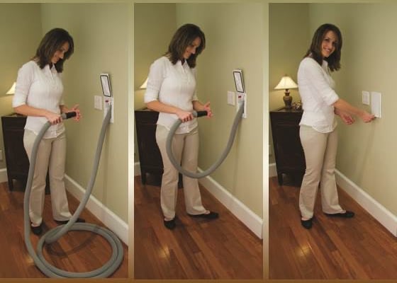 a woman is using a vacuum cleaner to clean her house
