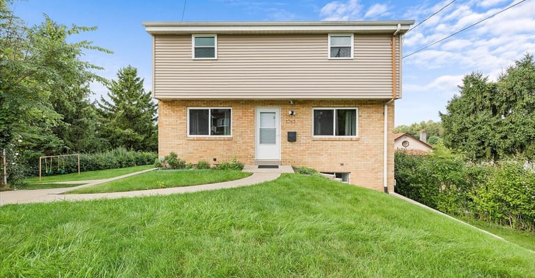 Discover this modern two-story vacation home in Pittsburgh’s Northside, featuring a spacious backyar