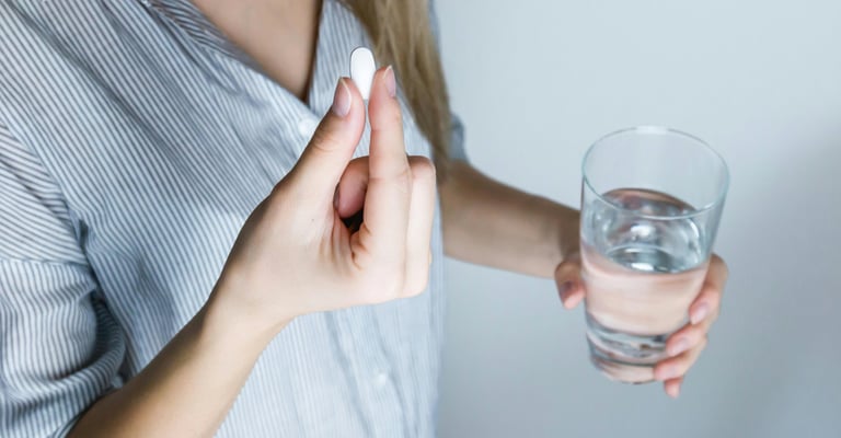 woman taking proton pump inhibitors medication