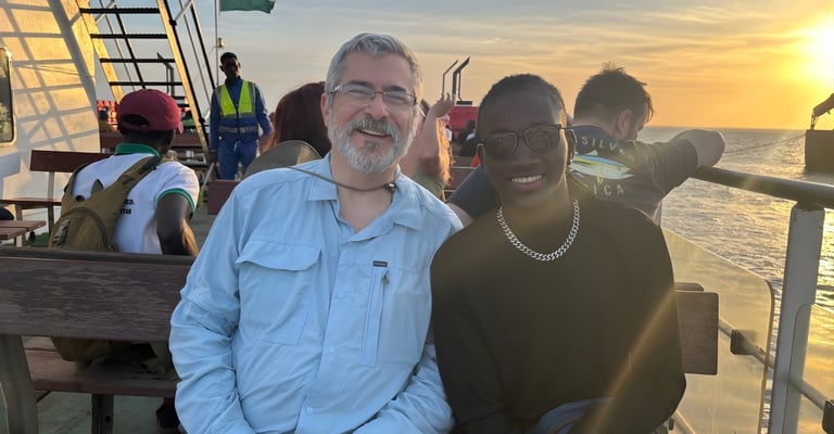 Stephanie's father and fiancé are aboard a ferry heading to Kunta Kinteh Island.