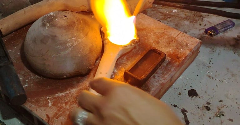 Tourist forging silver to make emerald ring in Bogota workshop