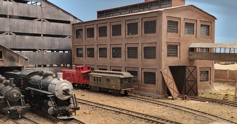 Superior Mine diorama with locomotive and mine buildings.