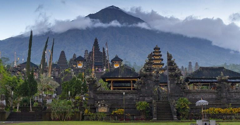 Traditional Balinese architecture at Besakih Temple surrounded by lush mountain scenery
