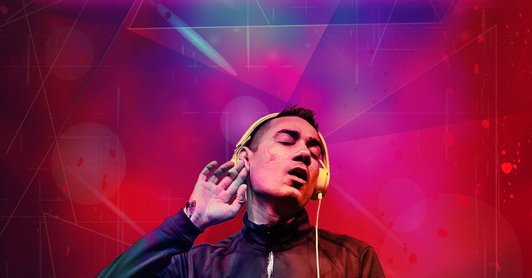 a man in a black jacket and headphones on a dj set