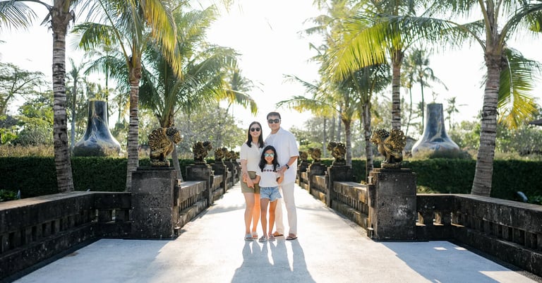 Family portrait captured along a garden pathway at InterContinental Bali Resort Bali