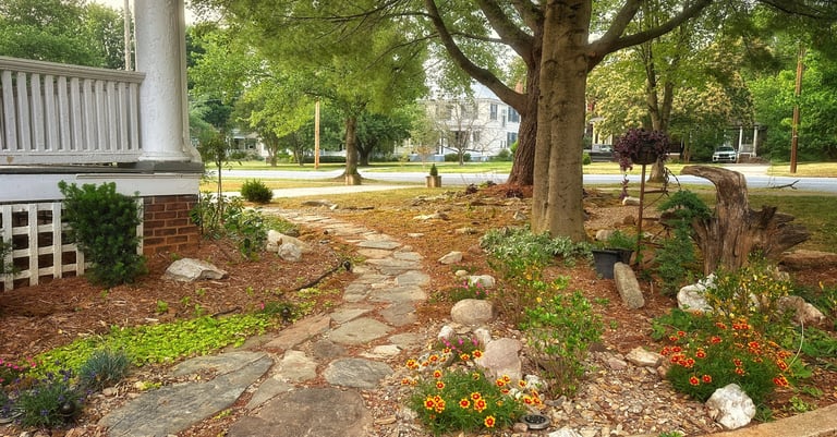 stone walkway and flowers and front porch 2123 rivermont