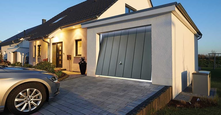 front of a house showing a grey garage door