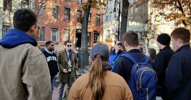 Dr. Hooton discussing LGBTQ+ history in New York City with students. Outside The Stonewall Inn in NY