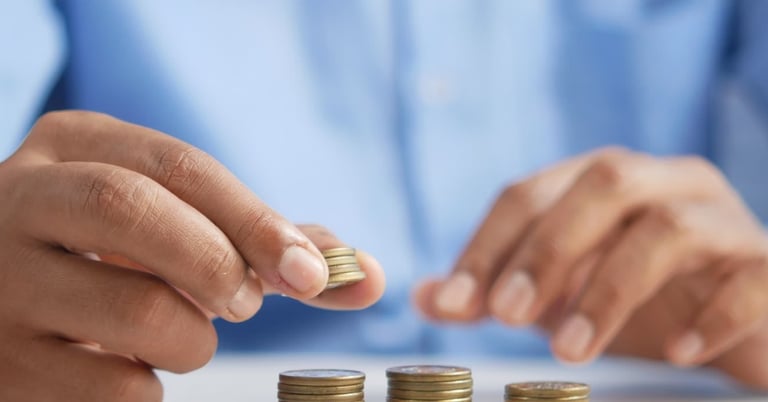 gold coins on table representing beginners guide to gold ira