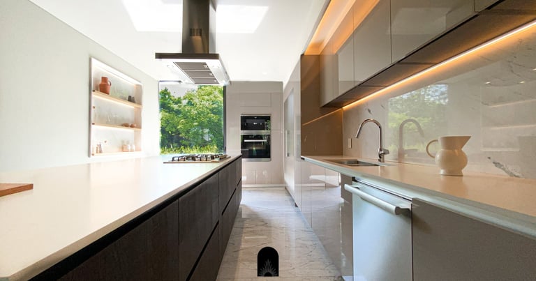 a kitchen with a long counter top and a large window