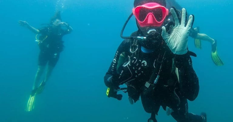 a person in a scuba suit and scuba goggles