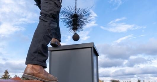A chimney being swept from the top down