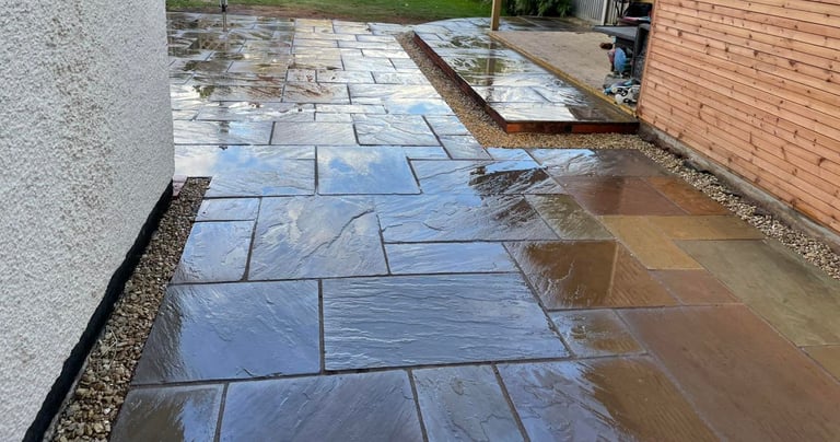 Levelled patio slabs in Worcester garden by B R Building and Landscapes
