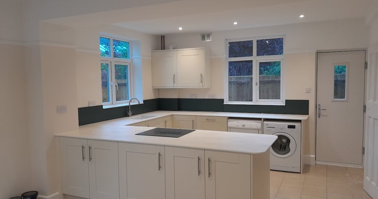 a freshly painted kitchen in Bournemouth with a washing machine