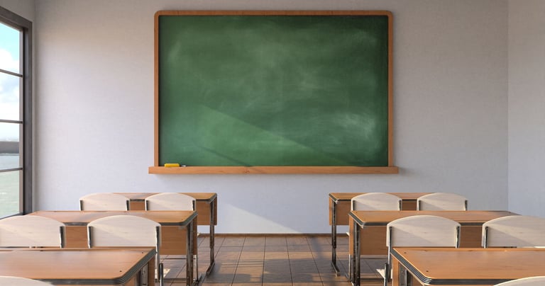 a classroom with desks and chairs and a chalkboard