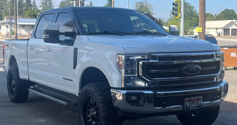 a ford power stroke with a lift kit and new tires from premier tire in sandpoint idaho