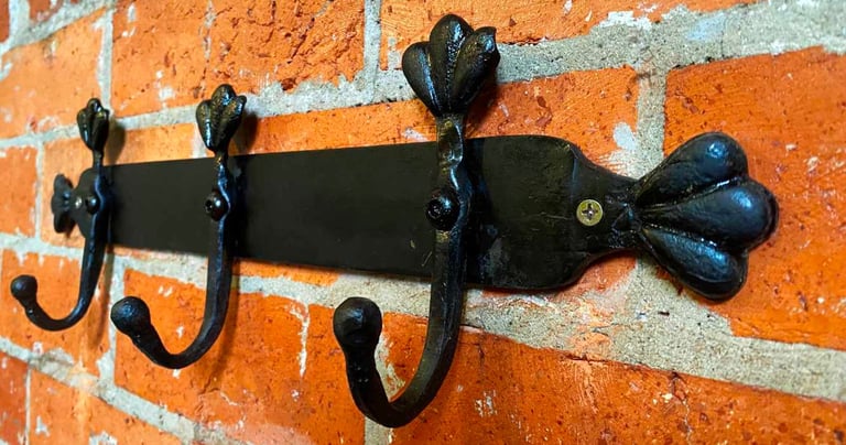 Sideview of metal coat rack attached to wall