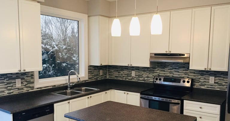 Image of a tile backsplash installation in kitchen
