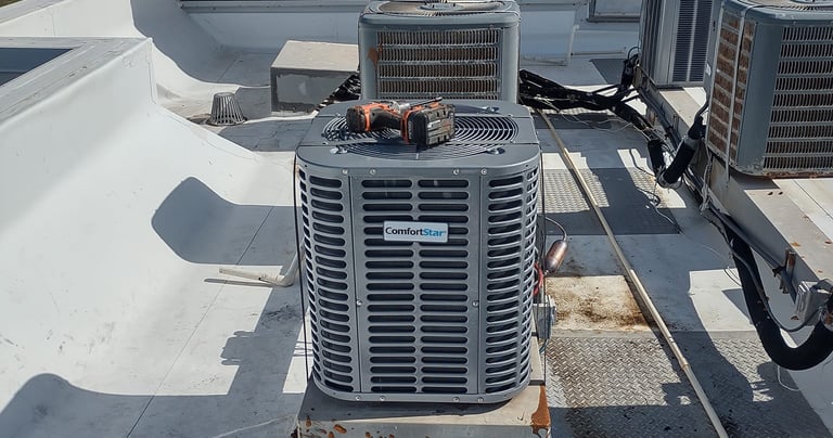 a couple of air conditioning units on a roof top