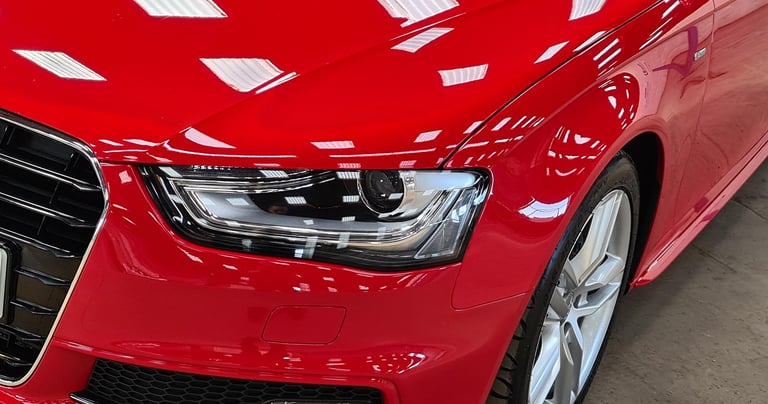 a red car parked in a garage