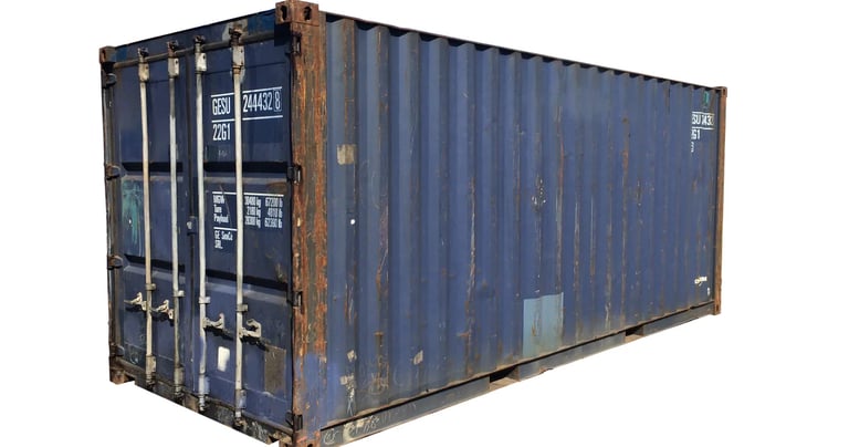 A blue cargo worthy 20ft shipping container with some rust dents and dings