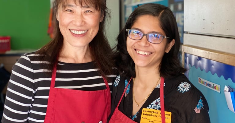 two docents standing together