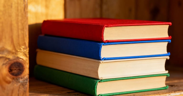 a stack of books on a shelf in a wooden shelf