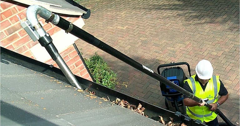 Gutter Vacuum in use by operator at C Thru Window Cleaners, Exeter.