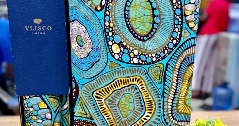 a notebook with a blue and yellow patterned cover
