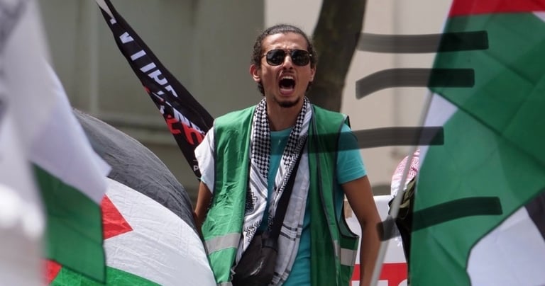 a man in a green vest and a scarf around his neck
