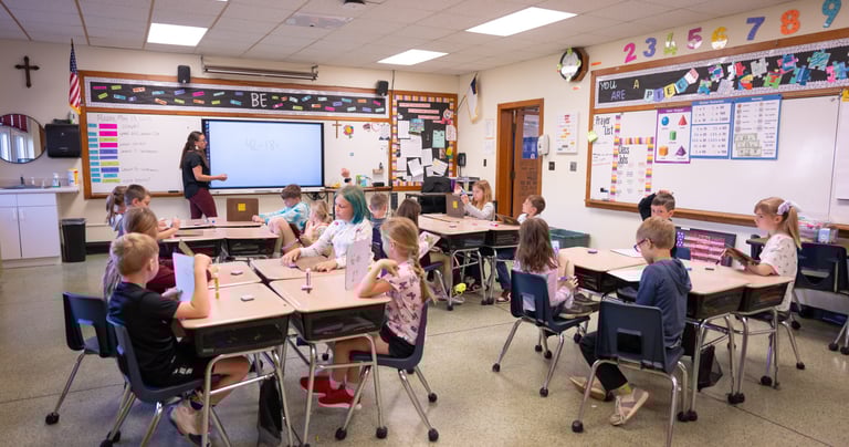 a classroom with a teacher and students in a classroom