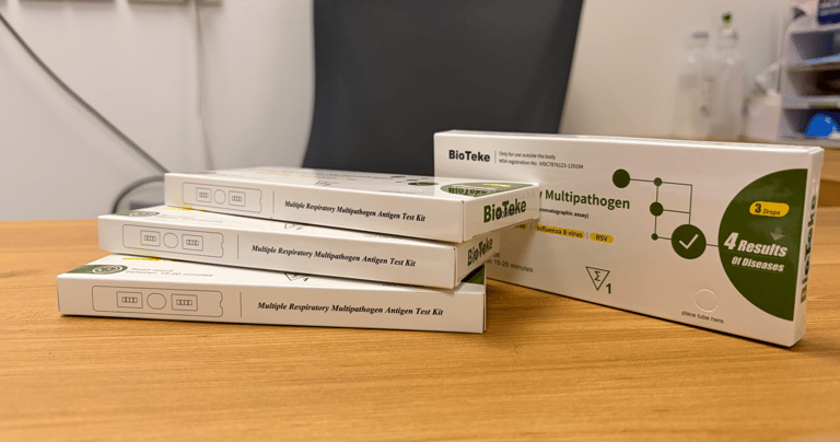 BioTeke multiple respiratory multipathogen antigen test kit boxes on a wooden desk.