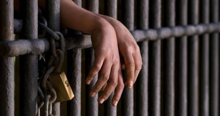 a person's hand holding a padlocked padlocked padlocked