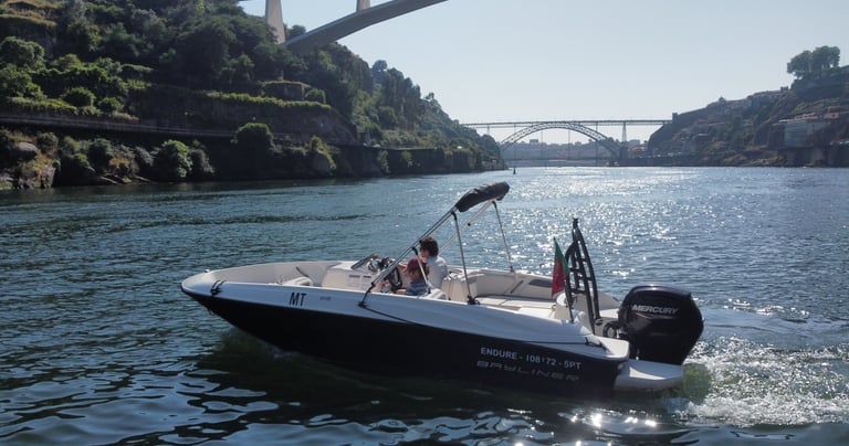 Private speedboat cruising on the Douro River in Porto